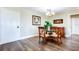 Dining area with wood floors, chandelier, and glass-top table at 10216 Regal Dr # 708, Largo, FL 33774
