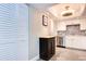 Updated kitchen with stainless steel appliances and white cabinets at 10216 Regal Dr # 708, Largo, FL 33774