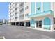 Condo building entrance with covered parking and seating at 10216 Regal Dr # 708, Largo, FL 33774