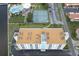 Aerial view showing building, tennis courts, and surrounding area at 10216 Regal Dr # 708, Largo, FL 33774