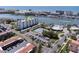 Aerial view of waterfront condo building with tennis court and pool at 10216 Regal Dr # 708, Largo, FL 33774