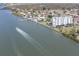 Aerial view of waterfront building and boat at 10216 Regal Dr # 708, Largo, FL 33774