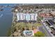 Aerial view of a waterfront condo building with a pool at 10216 Regal Dr # 708, Largo, FL 33774