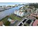 Coastal building, pool, tennis courts, and waterway views at 10216 Regal Dr # 708, Largo, FL 33774