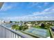 Stunning aerial view showcasing waterfront property, tennis courts, and beautiful landscaping at 10216 Regal Dr # 708, Largo, FL 33774