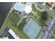Aerial showing tennis courts, pool, and parking area at 10216 Regal Dr # 708, Largo, FL 33774