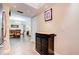 Hallway view of kitchen and dining area with dark wood floors at 10216 Regal Dr # 708, Largo, FL 33774