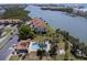 Aerial view of waterfront community with pool and lush landscaping at 10216 Regal Dr # 708, Largo, FL 33774