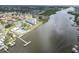 Aerial view of waterfront community, tennis courts, pool, and building at 10216 Regal Dr # 708, Largo, FL 33774