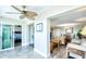 Bright sunroom with tiled floor, ceiling fan, and views of the surrounding area at 10216 Regal Dr # 708, Largo, FL 33774