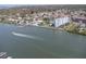Aerial view of waterfront property with boat passing by at 10216 Regal Dr # 708, Largo, FL 33774