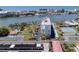 Aerial view of waterfront community, pool, tennis courts, and building at 10216 Regal Dr # 708, Largo, FL 33774