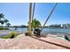Brick paved patio area with grill and waterfront view at 10216 Regal Dr # 708, Largo, FL 33774