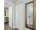 Hallway with built-in storage and mirror at 10216 Regal Dr # 708, Largo, FL 33774