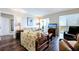 Bright living room with hardwood floors, comfy sofas, and sliding glass doors leading to a balcony at 10216 Regal Dr # 708, Largo, FL 33774
