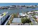 Aerial view showing tennis courts, pool, and waterfront location at 10216 Regal Dr # 708, Largo, FL 33774