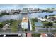 Coastal building with tennis courts, pool, and waterway views at 10216 Regal Dr # 708, Largo, FL 33774