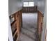Hallway under construction with exposed framing, showing new tile floor at 1985 Michigan Ne Ave, St Petersburg, FL 33703