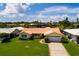 Single story house with tile roof and a two-car garage at 1985 Michigan Ne Ave, St Petersburg, FL 33703