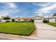 Single-story house with a spacious lawn, attached garage, and tile roof at 1985 Michigan Ne Ave, St Petersburg, FL 33703