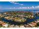 Aerial view of waterfront home in a community with canals and lush landscaping at 1985 Michigan Ne Ave, St Petersburg, FL 33703
