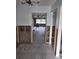 View through doorway shows home's interior under renovation, featuring exposed walls and new tile at 1985 Michigan Ne Ave, St Petersburg, FL 33703