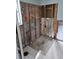 Bathroom under renovation; exposed shower pan and framing at 1985 Michigan Ne Ave, St Petersburg, FL 33703