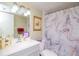 Bathroom featuring a framed mirror, patterned shower curtain, and neutral walls at 2400 Winding Creek Blvd # 25-101, Clearwater, FL 33761