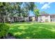 Attractive condo community featuring well-kept grounds and mature trees at 2400 Winding Creek Blvd # 25-101, Clearwater, FL 33761