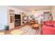 Living room featuring wood floors, neutral walls, and built in shelves at 2400 Winding Creek Blvd # 25-101, Clearwater, FL 33761
