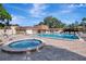 Community pool with hot tub at 2400 Winding Creek Blvd # 25-101, Clearwater, FL 33761