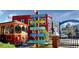 Charming street scene with colorful signs and a trolley stop in a vibrant neighborhood at 2400 Winding Creek Blvd # 25-101, Clearwater, FL 33761