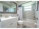 Well-lit bathroom featuring a tub with shower, modern fixtures, and a large mirror at 4411 Rustic Dr # 4411, New Port Richey, FL 34652