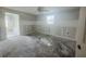 Renovation project: A bedroom in progress with exposed walls, a ceiling fan, and ample natural light at 4411 Rustic Dr # 4411, New Port Richey, FL 34652