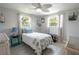 Bright bedroom with a twin bed, decorative pillows, and two windows at 4411 Rustic Dr # 4411, New Port Richey, FL 34652