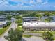 Aerial view showcasing condo unit near a lake at 4411 Rustic Dr # 4411, New Port Richey, FL 34652