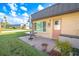 View of the home's exterior, showing the patio and landscaping at 4411 Rustic Dr # 4411, New Port Richey, FL 34652