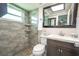 Updated bathroom with a walk-in shower and modern vanity at 4411 Rustic Dr # 4411, New Port Richey, FL 34652
