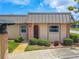 Condo exterior featuring a charming light-colored facade at 4411 Rustic Dr # 4411, New Port Richey, FL 34652
