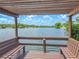 Serene lakeside gazebo with wooden benches at 4411 Rustic Dr # 4411, New Port Richey, FL 34652
