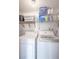 Laundry room with washer, dryer, and ample shelving for storage at 4411 Rustic Dr # 4411, New Port Richey, FL 34652