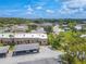 Aerial view of condo community showing building and landscaping at 4411 Rustic Dr # 4411, New Port Richey, FL 34652