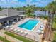 Community pool with lounge chairs and a lakeside view at 4411 Rustic Dr # 4411, New Port Richey, FL 34652