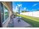 Private backyard patio with table and chairs, perfect for outdoor dining at 4411 Rustic Dr # 4411, New Port Richey, FL 34652