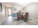 Bright dining area with a glass-top table and wicker chairs at 4411 Rustic Dr # 4411, New Port Richey, FL 34652