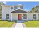 Modern two-story house with a red door and gray siding at 1216 15Th S Ave, St Petersburg, FL 33705