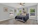 Bright bedroom with a queen bed and large windows at 1216 15Th S Ave, St Petersburg, FL 33705