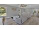 Living room with sectional sofa and ceiling fan at 1216 15Th S Ave, St Petersburg, FL 33705