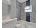 Modern bathroom with marble tile, bathtub, and updated vanity at 1216 15Th S Ave, St Petersburg, FL 33705