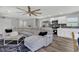 Open living room with large sectional sofa and adjacent kitchen at 1216 15Th S Ave, St Petersburg, FL 33705
